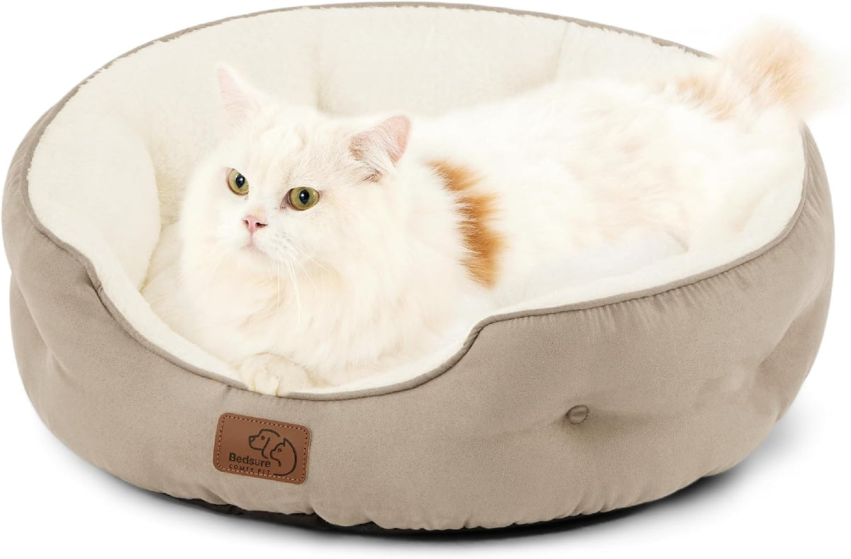Beige plush pet bed for cats and small dogs with soft cushioned interior